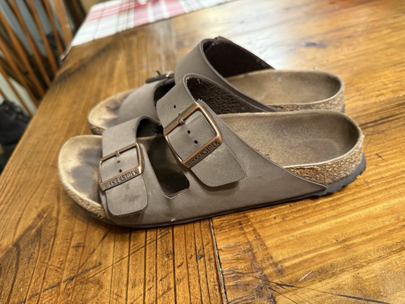 Birkenstock Arizona sandals in natural leather with a contoured cork footbed